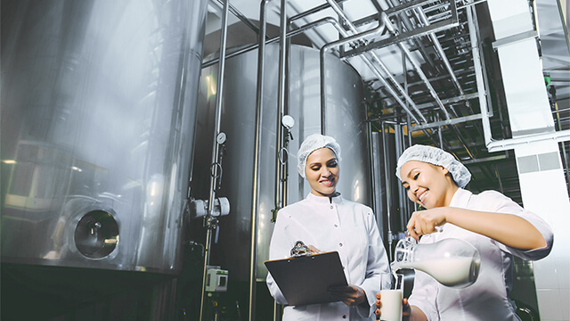 Dairy plant women milk colour corrected